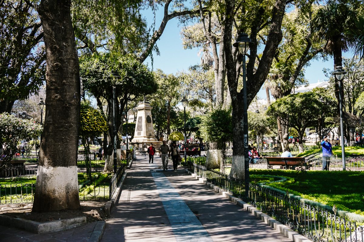 Find a bench and observe local life of Sucre Bolivia.