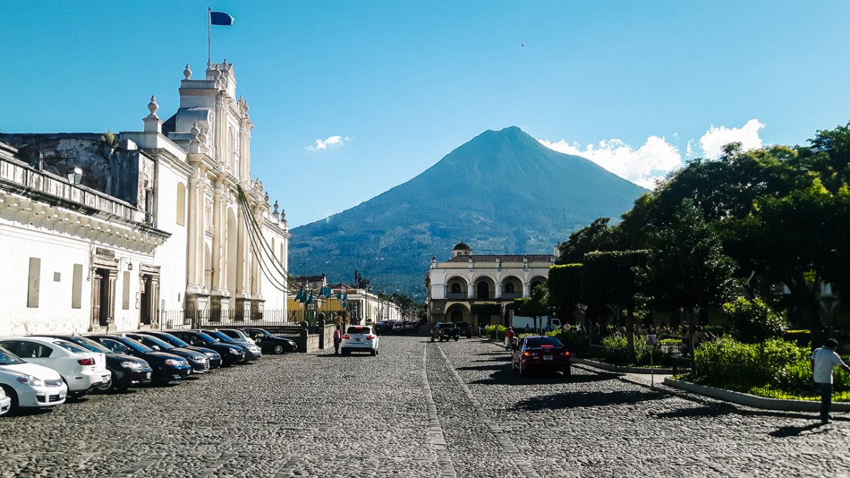 Plaza central in Antigua Guatemala with volcano view.