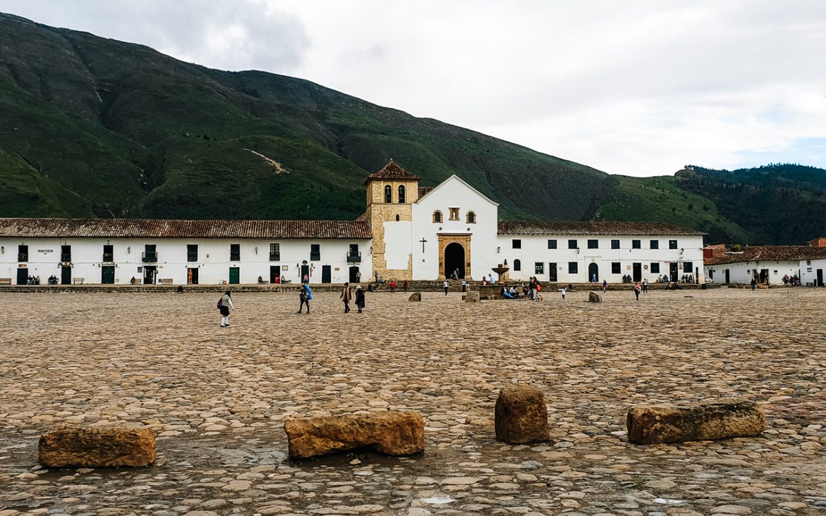 Plaza Mayor with church, one of the best things to do in Villa de Leyva Colombia.
