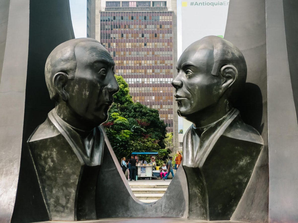 Monumento de la Raza, an artwork by Rodrigo Arenas Betancourt that include two gigantic bronze statues of murdered politicians, and a memorial to all journalists who have been killed by violence over the years - one of the things to do in Medellin Colombia downtown. 