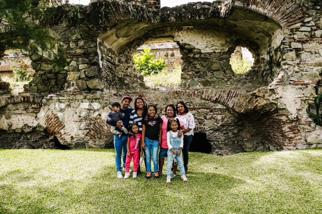 Local family in front of Iglesia de San Francisco - one of the most famous ruins in Antigua. 