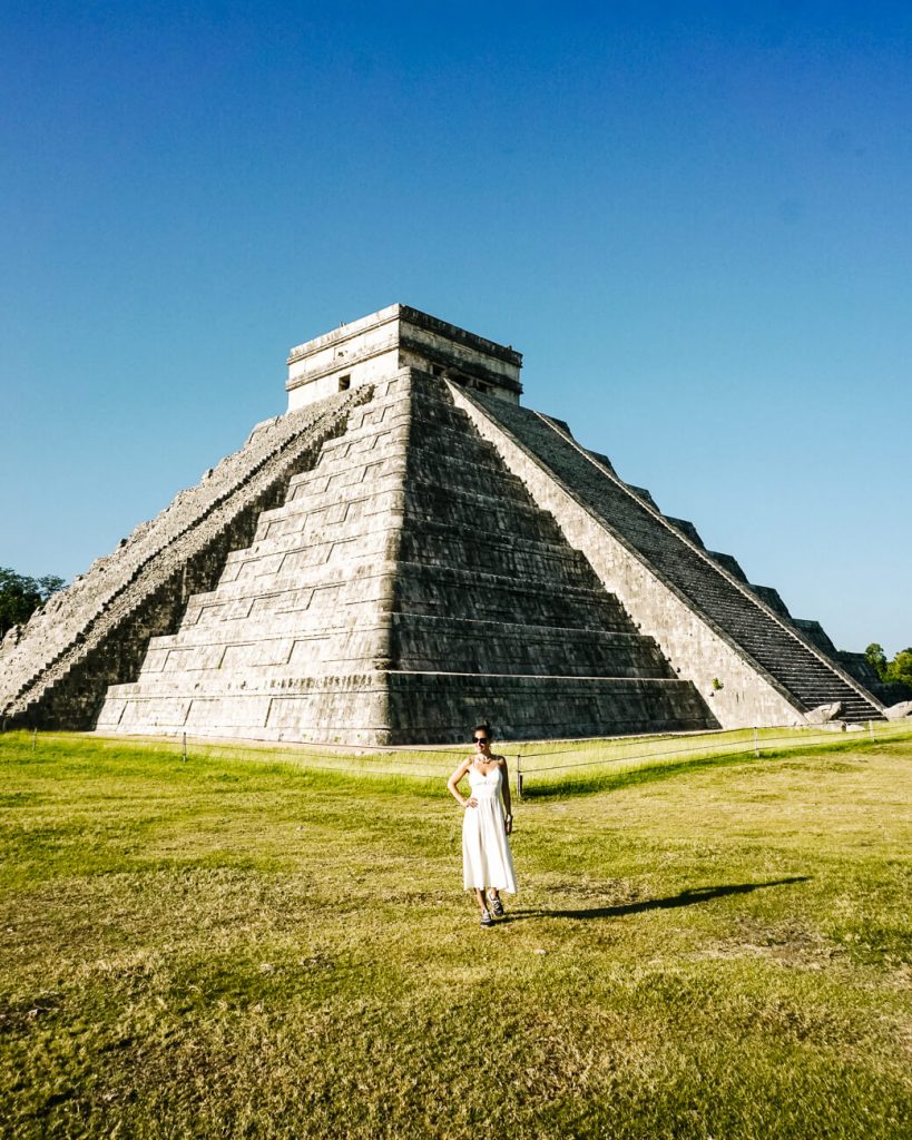 Deborah in front of temple Cuculkan in Chichén Itzá, one of the most famous things to do in Mexico.
