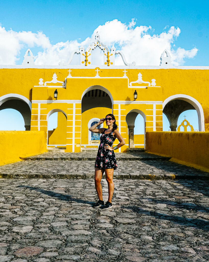 Deborah in front of yellow convent: Convento de San Antonio de Padua, one of the best things to do in the yellow city of Mexico