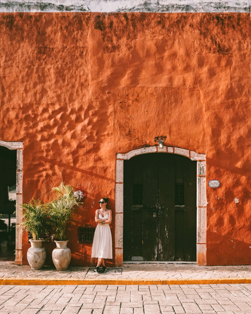 Orange walls in Valladolid - a city to include in your Mexico Yucatán itinerary 3 weeks.