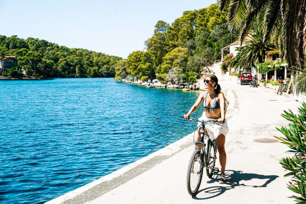 deborah on bike in Mljet National Park, one of the best ways to discover this area