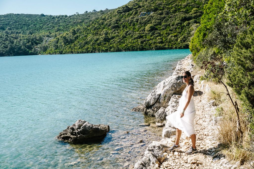 woman at lake in Mljet Island, one of the best islands to visit in Croatia if you want to enjoy nature