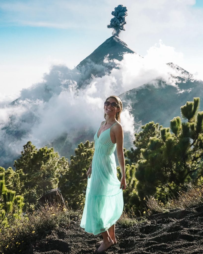 Deborah in front of the erupting Fuego volcano during Acatetango hike in Guatemala