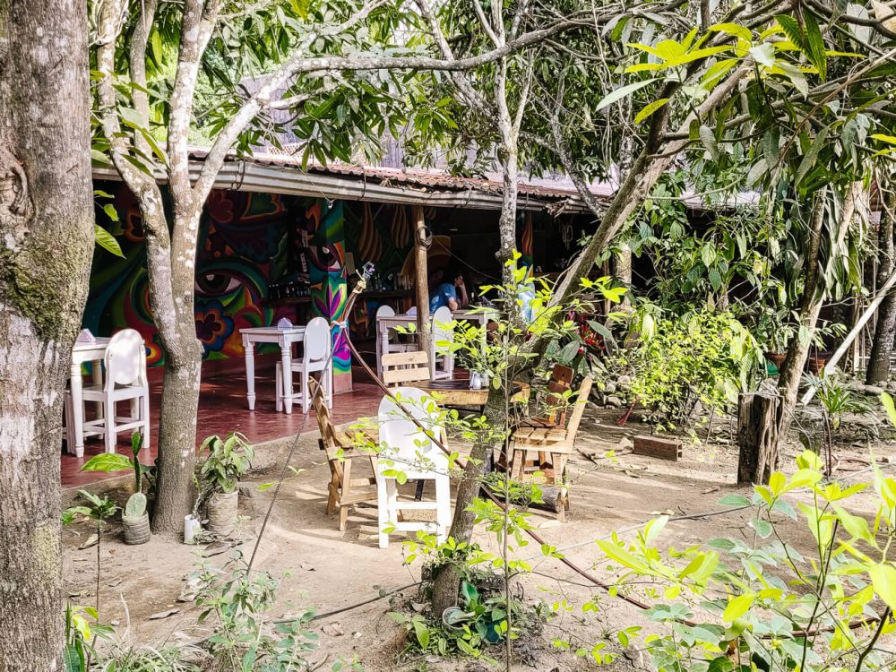 Restaurant in lush environment.