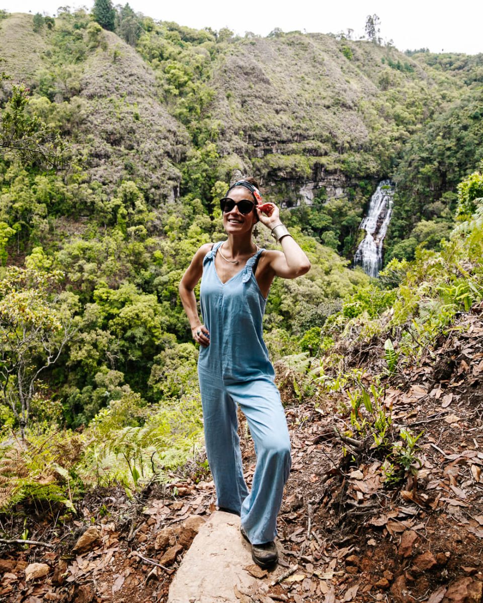 Deborah in front of waterfall in Reserva Natural y Cascada Los Tucanes