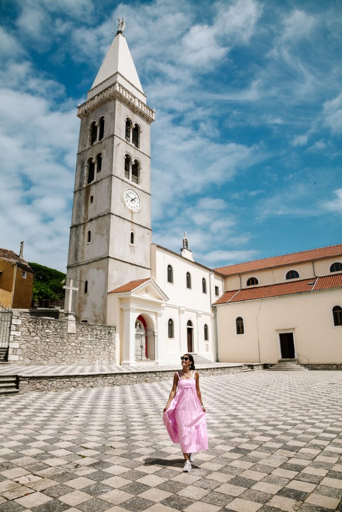 Deborah in front of church on Mali Losinj island in Croatia