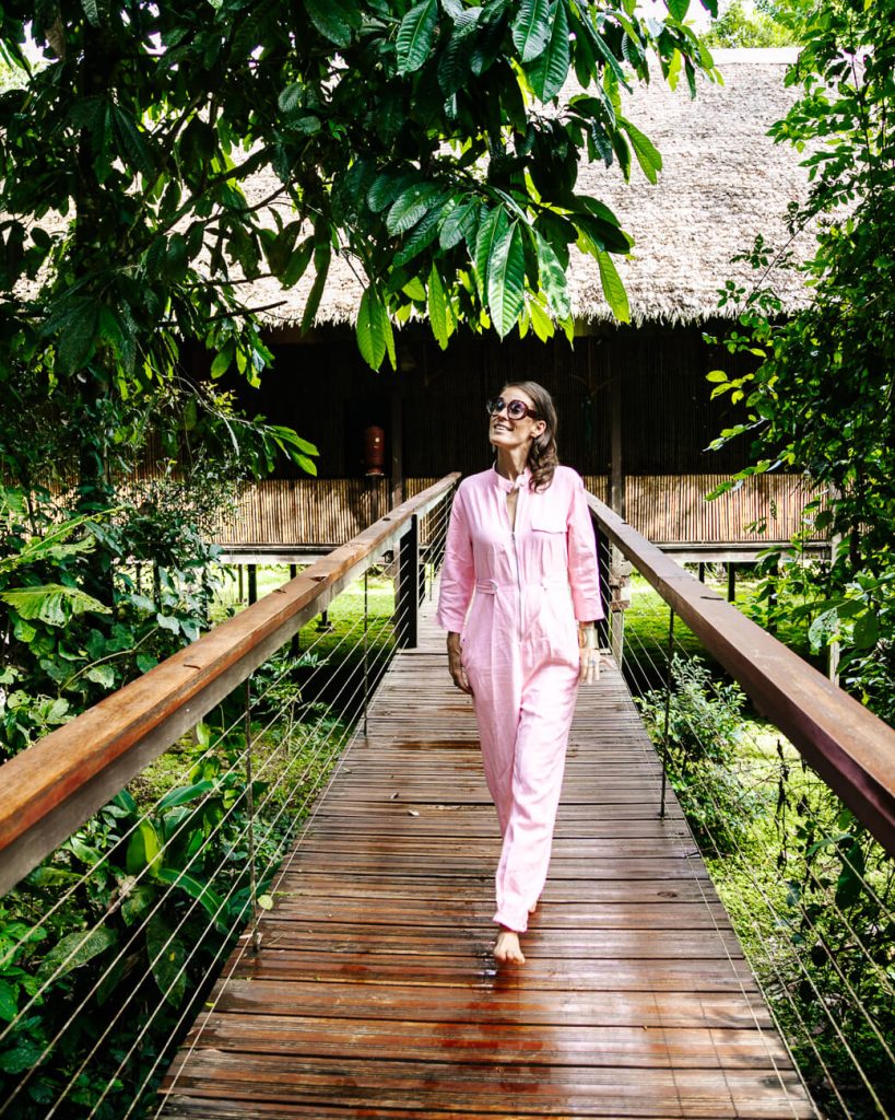 Deborah on boardwalk at Tambopata Research Center - jungle lodge Peru by Rainforest Expeditions.