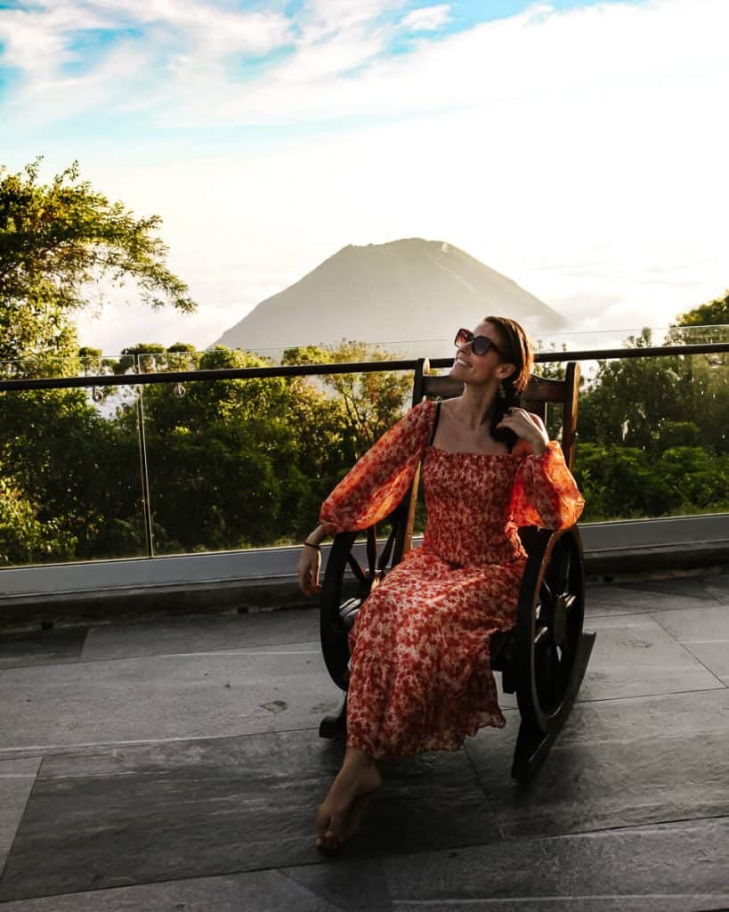Deborah in famous chair of Casa 1800 Cerro Verde, looking over the Santa Ana volcano - one of the most beautiful boutique hotels in El Salvador.