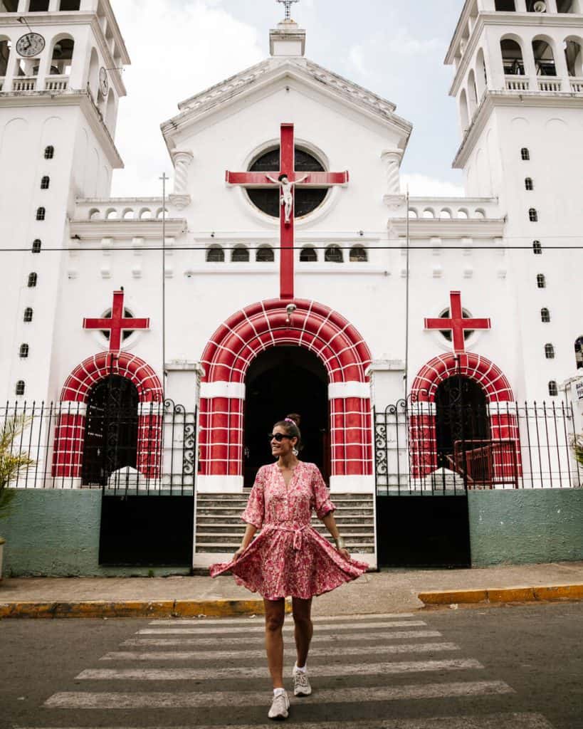 Deborah in front of church in Juayua - a small and quiet village, located in the mountains along La Ruta de las Flores El Salvador.