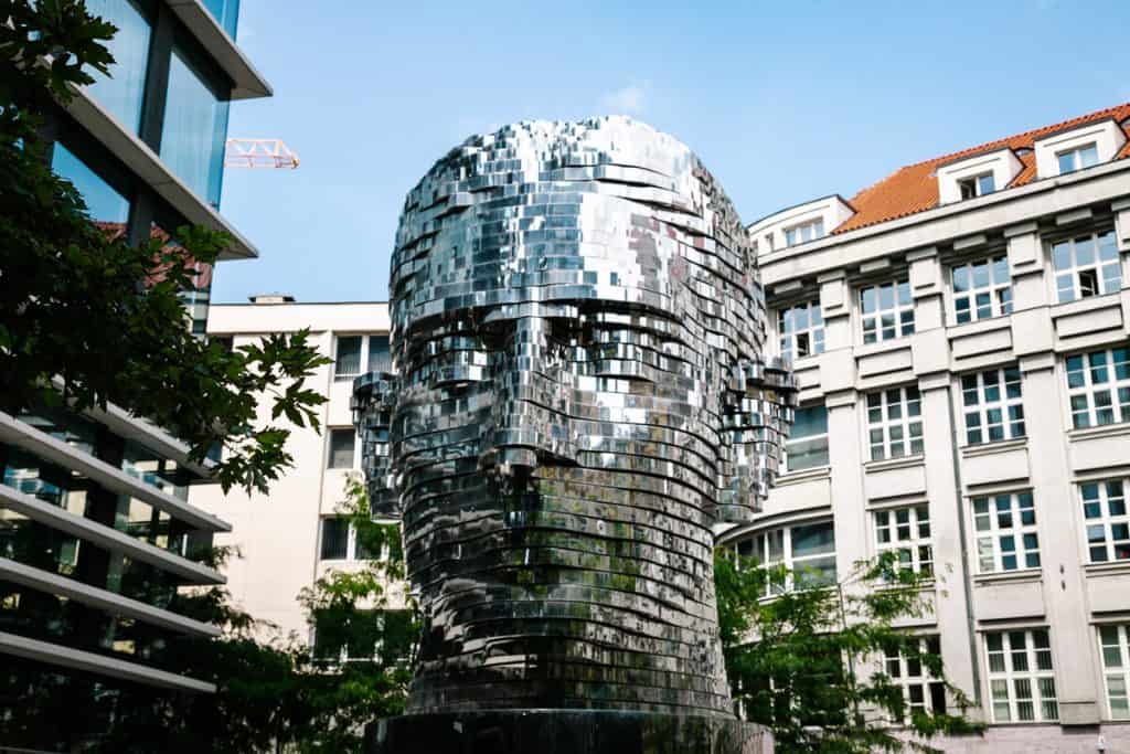 Kafka statue, by David Černý, which consists of rotating discs that together form a statue of Franz Kafka.