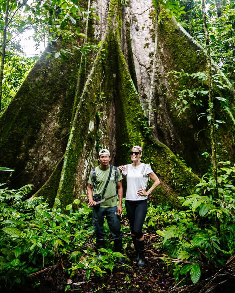 Deborah with guide at ceiba tree in jungle.