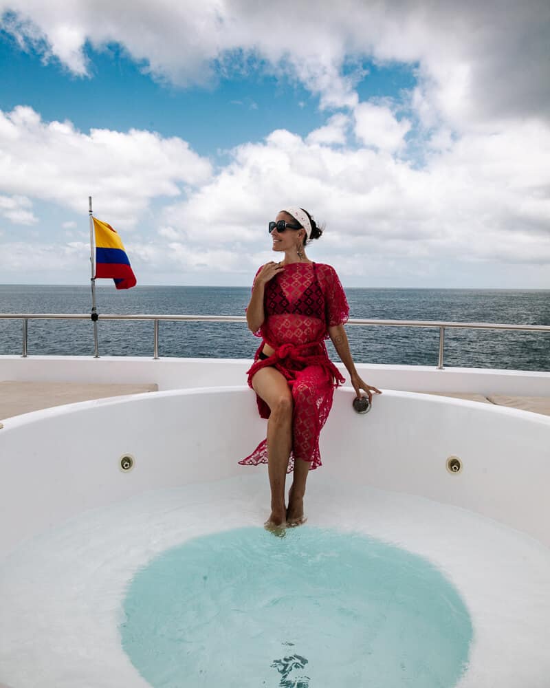 Deborah in jacuzzi of the Golden Galapagos Islands Elite 4 day cruise in Ecuador. 