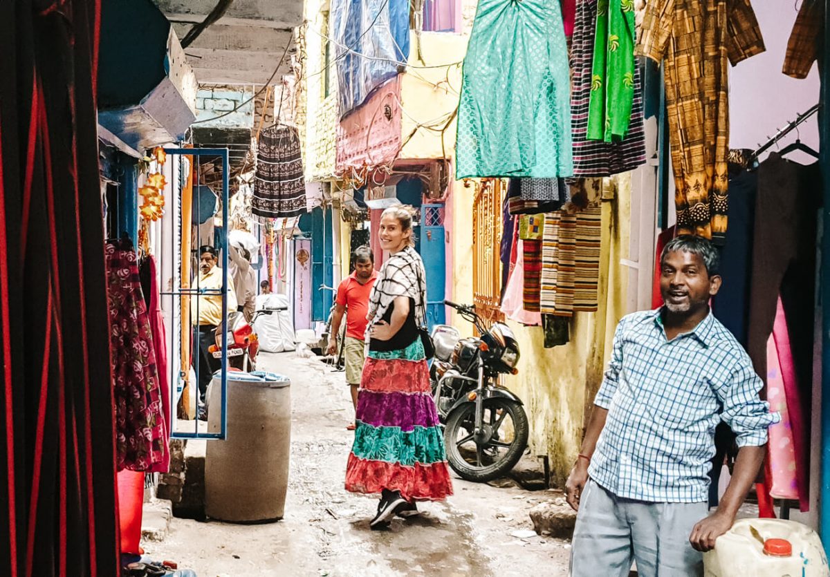 Man posing in slum.
